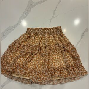 Altar’d State crème skirt with orange flowers.